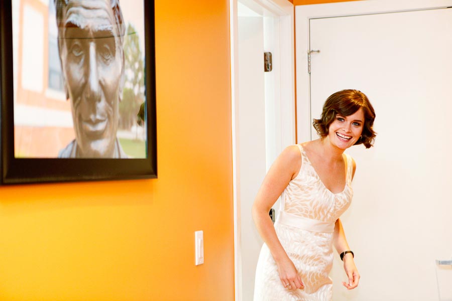 Bride fits her J. Crew wedding dress before ceremony. Wedding photojournalistic, Chicago photographers