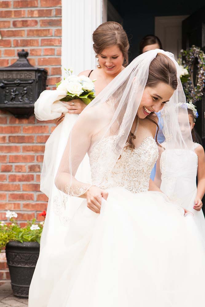 Bride smiles in Wedding dress by Stella York, Saint Paul Wedding Photographers