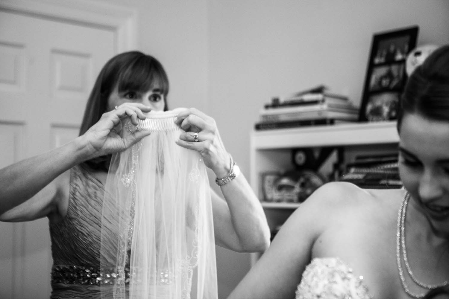 Black and white portrait of bride wearing bridal veil. Wedding day photojournalism. MInneapolis Wedding Photographers