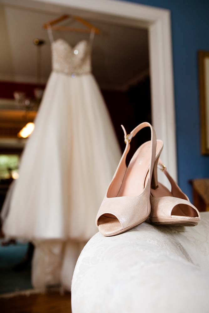 Wedding dress and bride shoes detail. Minneapolis Wedding Photographer