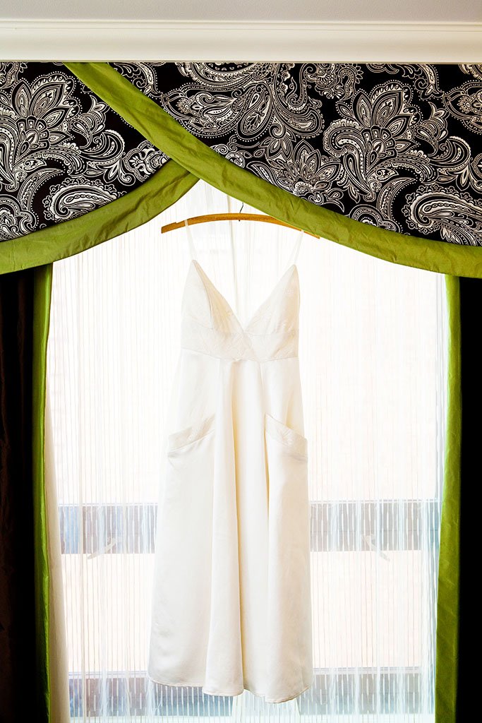 Simple Summer Wedding Dress hanging in a window at the Palmer House Hilton Chicago